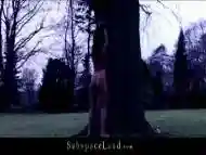 Bombastic brunette gets humiliated in a hard BDSM woods scene