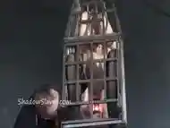 Caged blonde slave is cruelly burned with big red candles