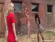 Dude tied up in the outdoors and spanked by girls