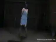 Hanging on the rope she begs to get air BDSM