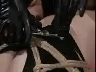 Lezdom mistress prepares pussy torture for her bound BDSM slave