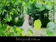 Stimulating blonde is tired up and does a blowjob in woods