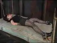 Submissive girl tied up to a bed and disciplined BDSM