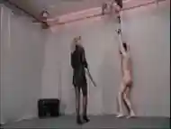 Tied up male slave receives hard whipping from BDSM mistress