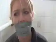 A Hot Milf Gets Bound With Duct Tape In The Toilet. Full Video