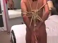 Naked woman outlandish bondage at home with horny man