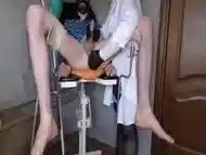 Nurse Gives Liter Enema To A Patient In A Gynecological Chair