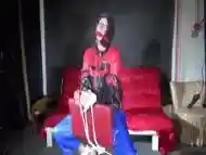 Sexy Pia Being Tied And Gagged On A Chair Wearing Sexy Shiny Nylon Rainwear (Video)