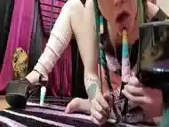 submissive gets out of her cage and masturbate with high heels and dildo.