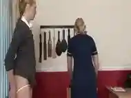 Kinky blonde teacher is spanking one of her naughty girls, to teach her a lesson