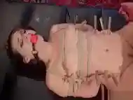 Lesbian slave ass paddled in corset shop