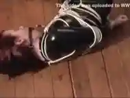 Ball Gagged and Floor Tied in pvc Catsuit