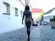 Girl has to walk in latex catsuit on the street because she lost a bet