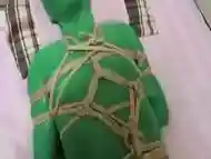 Kigurumi plays with zentai in bondage