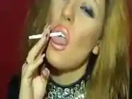 Smoking blonde in heavy makeup long nails