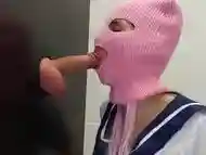 Schoolgirl sucks cock over the wall in the public toilet at the glory hole