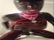 Latex covered and caged guy takes on a fucking machine