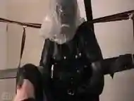 Standing Bondage In Leather Straitjacket