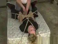 Young blond twinky roped down for a powerful handjob