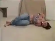 Arielle hogtied and ballgagged