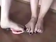 2 giantess crushing male toy with their sexy feet