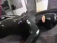 Girl in full Latex condom catsuit