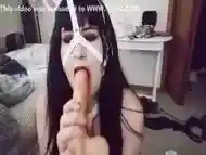 Gothic bondage bunny playing with dildo