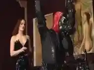 Latex mistress using her slave