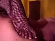 Mistress Amberle, in fishnets, walking all over her bound slave