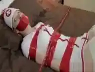 Nurse bondage and ticked on bed