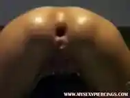 Pierced thrall with biggest anal plug in her arse