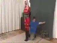 Red Superheroine in Bondage and humiliated