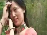 Chinese Beauty In Metal Bondage Outdoors