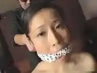 Busty Asian woman is bound and gagged