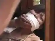 Japanese babe bound and gagged in a back yard