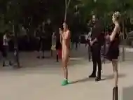 Naked brunette posing in public