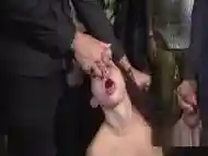 Petite slave gets facials in public bar