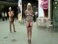 Submissive woman bound and exposed in public