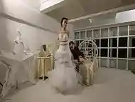 The bride in a white wedding dress was tied up with ropes