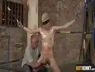 Blindfolded and strapped twink gets a handjob and blowjob