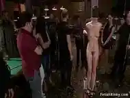 Blindfolded babe fucked in public hall