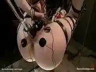 Blond in straight jacket suspended