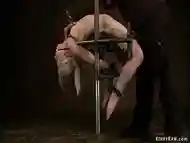 Blonde back bend in device bondage