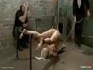 Blonde in pile driver bondage whipped