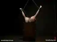 Busty redhead in upside down suspension