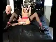 Naked slut gets aroused whilst being tied to the couch