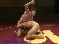 Oiled muscled men wrestling and fucking