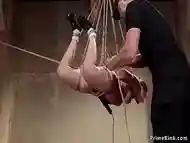 Redhead sub hogtied and suspended