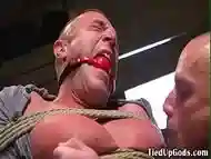 Ripped bdsm dom whipping muscle subs cock