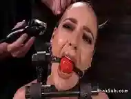 Slave in bondage device gets head shaved